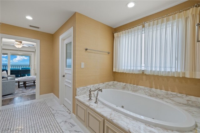 26628 Hickory Blvd, Bonita Springs, FL 34134 - bathroom featuring a jetted tub, recessed lighting, a ceiling fan, and marble finish floors