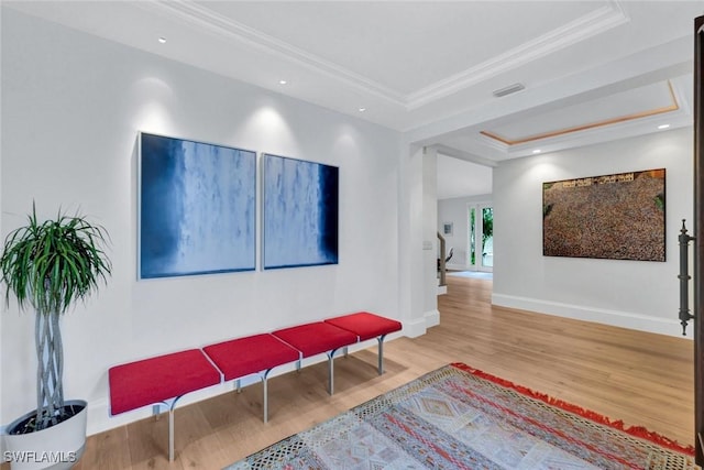 27571 Riverbank Dr, Bonita Springs, FL 34134 - sitting room with baseboards, crown molding, visible vents, a raised ceiling, and wood finished floors