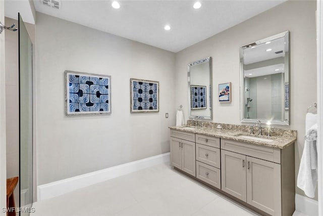 27571 Riverbank Dr, Bonita Springs, FL 34134 - bathroom with a shower with door, recessed lighting, double vanity, and a sink