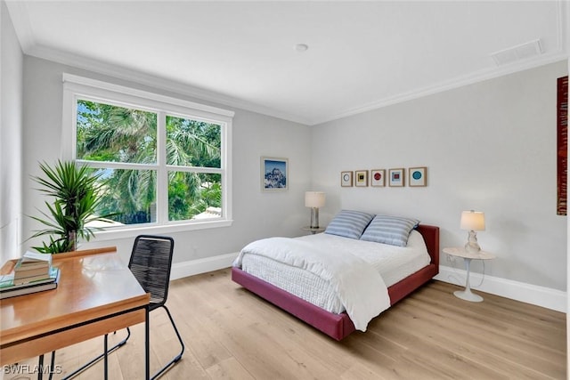27571 Riverbank Dr, Bonita Springs, FL 34134 - bedroom with light wood-style floors, baseboards, ornamental molding, and visible vents