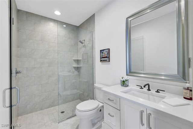 27571 Riverbank Dr, Bonita Springs, FL 34134 - bathroom with a shower stall, vanity, and toilet