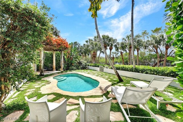 27571 Riverbank Dr, Bonita Springs, FL 34134 - outdoor pool featuring a patio, a fenced backyard, and a pergola