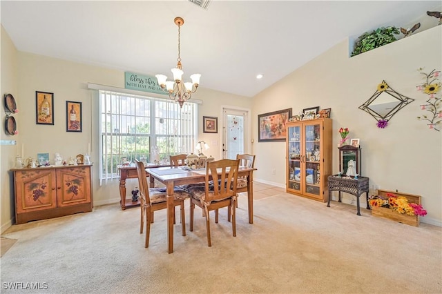 dining area featuring baseboards, lofted ceiling, a chandelier, and light colored carpet