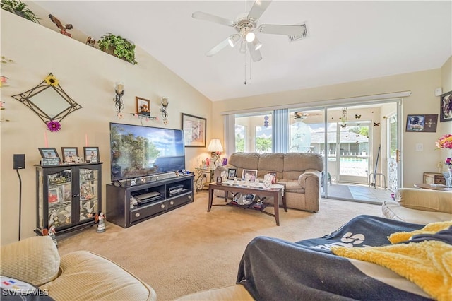 carpeted living area featuring a ceiling fan and lofted ceiling