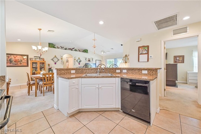 kitchen featuring black dishwasher, light colored carpet, visible vents, and a sink