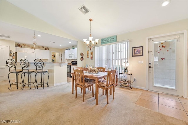 dining area with light colored carpet, vaulted ceiling, recessed lighting, light tile patterned floors, and a chandelier