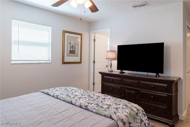 bedroom featuring visible vents and ceiling fan