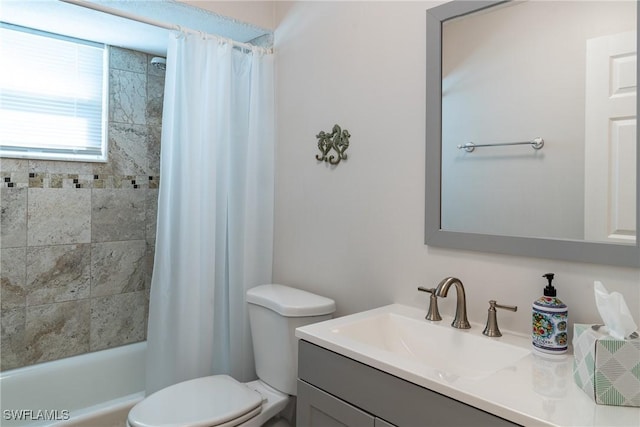 full bath featuring shower / tub combo with curtain, toilet, and vanity