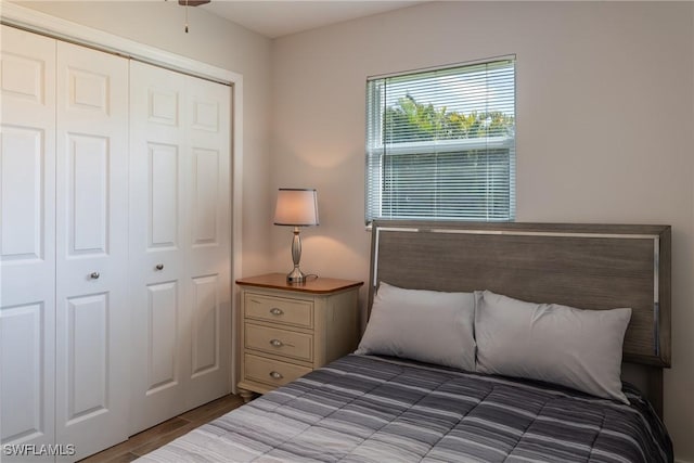 bedroom featuring a closet and wood finished floors