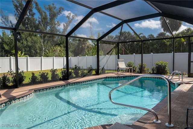 view of swimming pool featuring a patio, a fenced in pool, and a fenced backyard