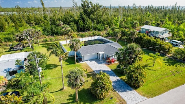 birds eye view of property featuring a view of trees