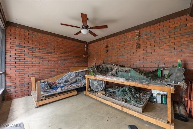 310 Trader Rd, Fort Denaud, FL 33935 - unfurnished bedroom with concrete flooring, ceiling fan, and brick wall