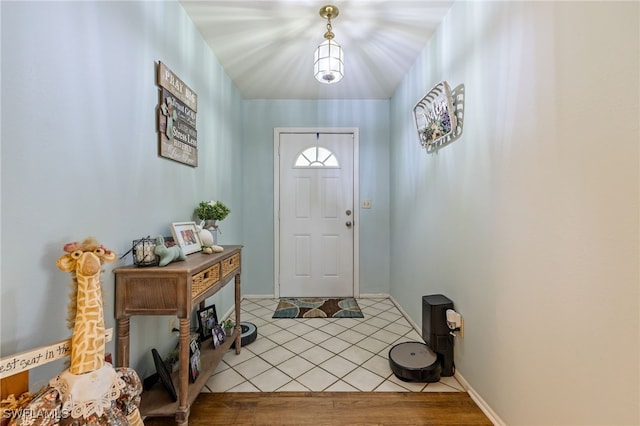310 Trader Rd, Fort Denaud, FL 33935 - foyer entrance with baseboards and tile patterned floors