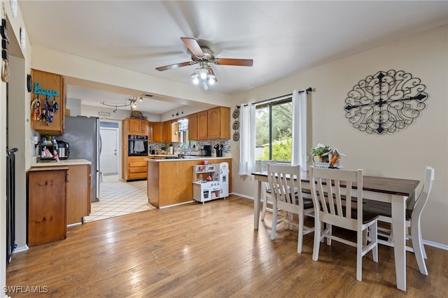 310 Trader Rd, Fort Denaud, FL 33935 - dining room with baseboards, light wood-style floors, and ceiling fan