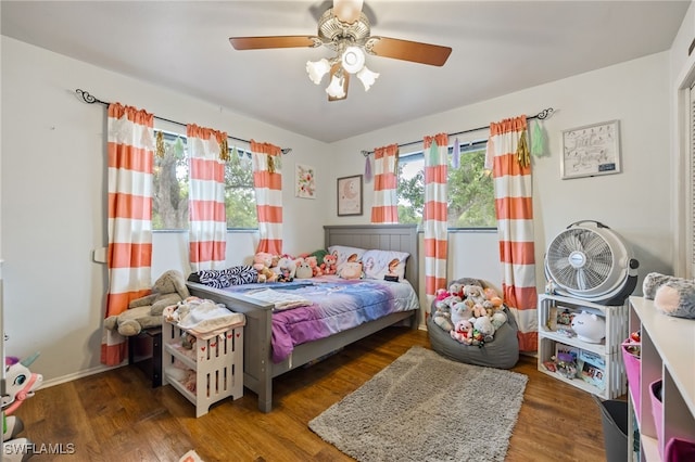 310 Trader Rd, Fort Denaud, FL 33935 - bedroom with wood finished floors, multiple windows, and a ceiling fan