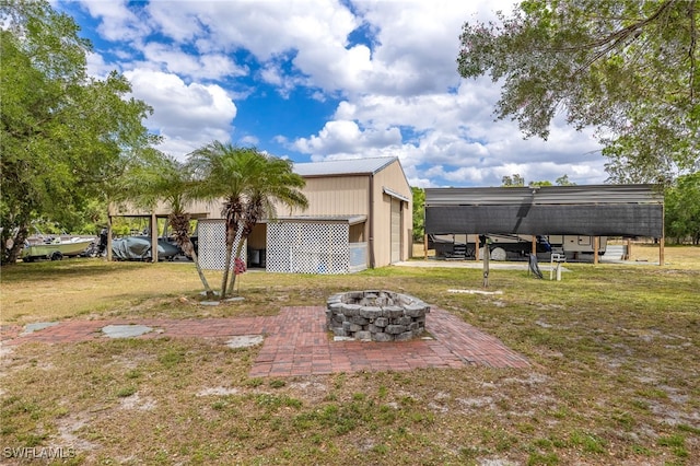 310 Trader Rd, Fort Denaud, FL 33935 - view of yard featuring an outdoor fire pit, an outdoor structure, and a pole building