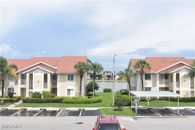 view of property with uncovered parking