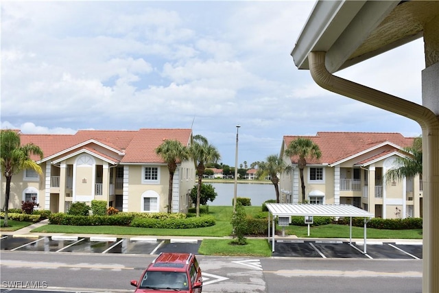 view of building exterior featuring uncovered parking