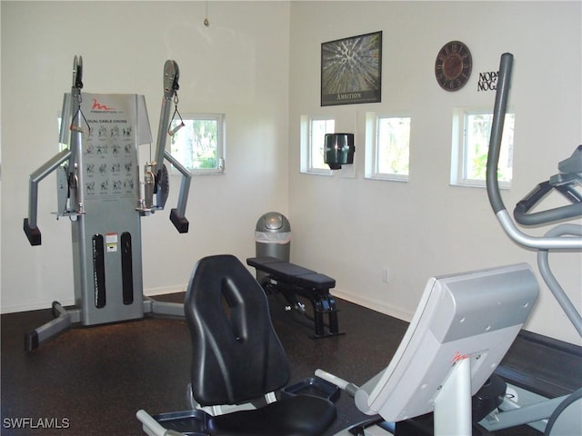 workout area featuring baseboards