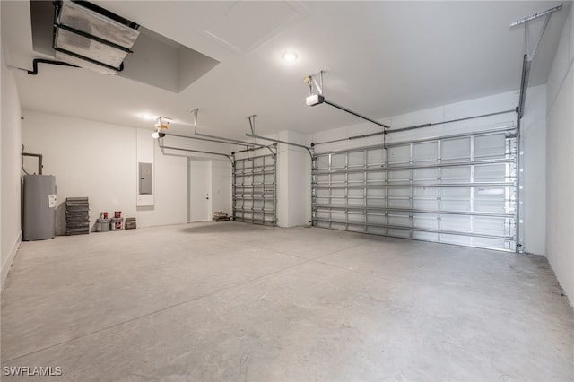 garage featuring water heater, electric panel, and a garage door opener