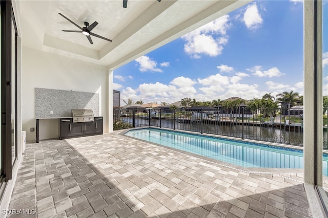 view of pool featuring a fenced backyard, a ceiling fan, a patio, and area for grilling