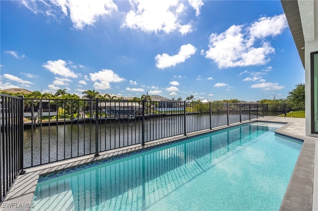 view of pool with a fenced in pool, a water view, and fence