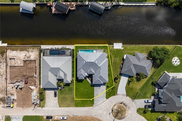 bird's eye view with a residential view and a water view