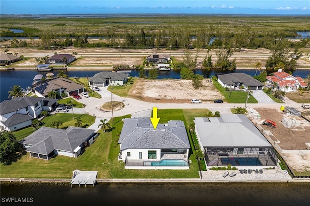 bird's eye view featuring a residential view and a water view