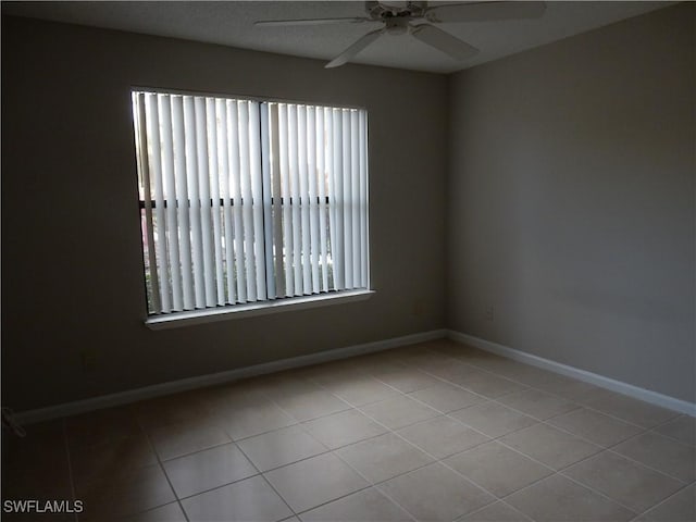 13621 Eagle Ridge Dr Unit 1518, Fort Myers, FL 33912 - tiled spare room with baseboards and ceiling fan