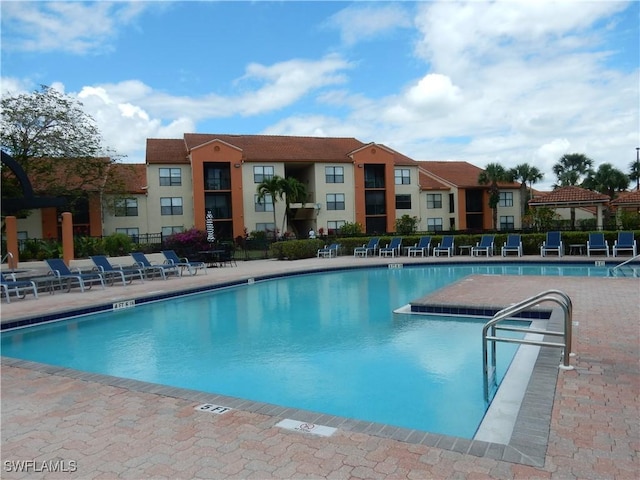 13621 Eagle Ridge Dr Unit 1518, Fort Myers, FL 33912 - pool with fence and a patio