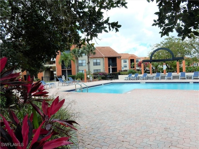 13621 Eagle Ridge Dr Unit 1518, Fort Myers, FL 33912 - community pool featuring a patio