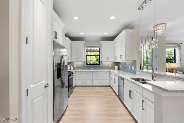 3260 Miyagi Ln, Naples, FL 34114 - kitchen featuring ornamental molding, a sink, stainless steel appliances, and tasteful backsplash