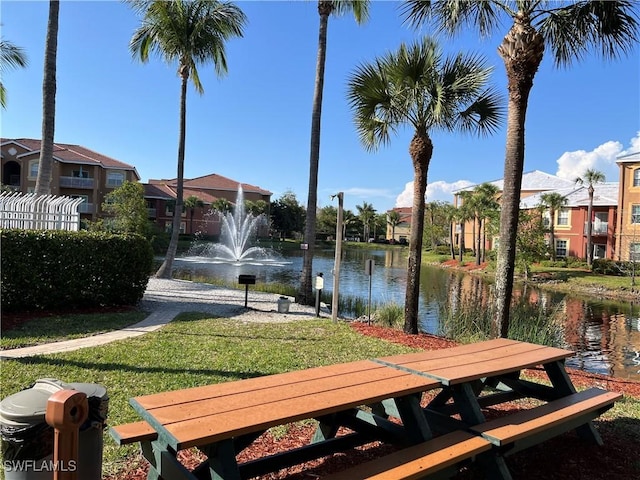 15585 Ocean Walk Cir Unit 216, Fort Myers, FL 33908 - view of community featuring a water view, a yard, and a residential view