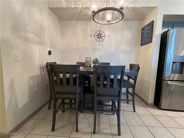 15585 Ocean Walk Cir Unit 216, Fort Myers, FL 33908 - dining room with a chandelier and tile patterned floors