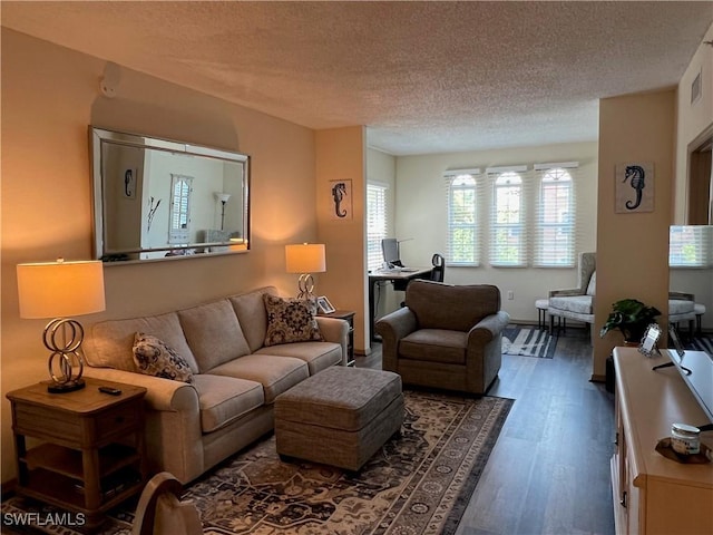 15585 Ocean Walk Cir Unit 216, Fort Myers, FL 33908 - living room with a textured ceiling, wood finished floors, and an office area