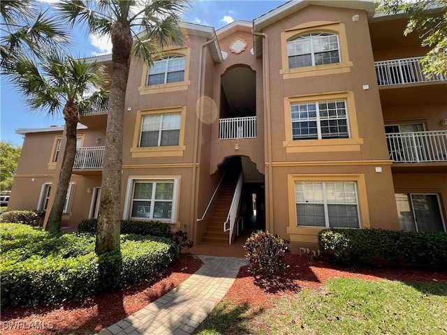 15585 Ocean Walk Cir Unit 216, Fort Myers, FL 33908 - view of building exterior featuring stairway