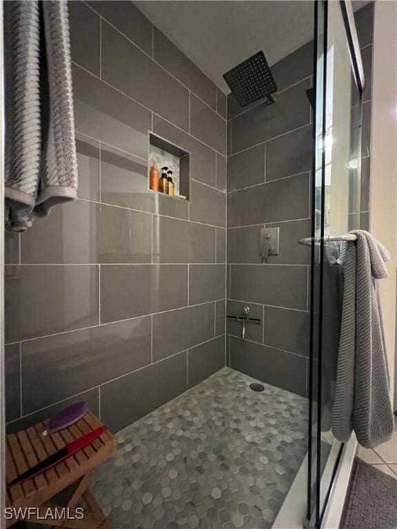 15585 Ocean Walk Cir Unit 216, Fort Myers, FL 33908 - bathroom with a shower stall and tile patterned floors