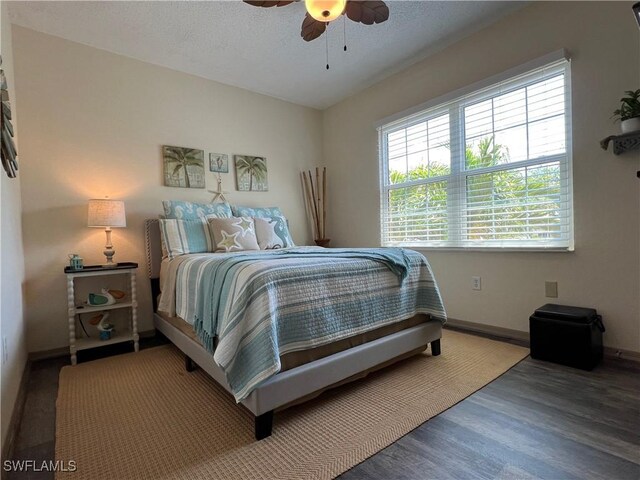 15585 Ocean Walk Cir Unit 216, Fort Myers, FL 33908 - bedroom with wood finished floors and ceiling fan