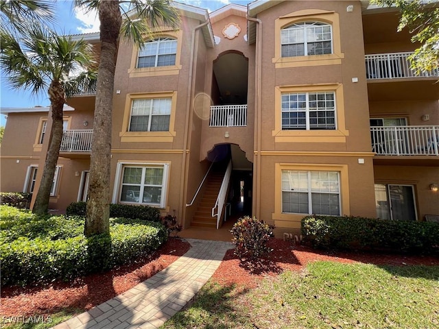 15585 Ocean Walk Cir Unit 216, Fort Myers, FL 33908 - view of property featuring stairs