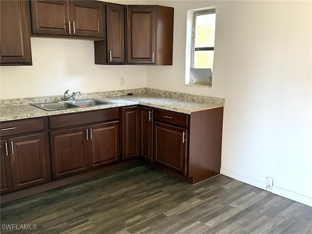 1308 Brookhill Dr, Fort Myers, FL 33916 - kitchen featuring baseboards, dark brown cabinetry, a sink, and dark wood-type flooring