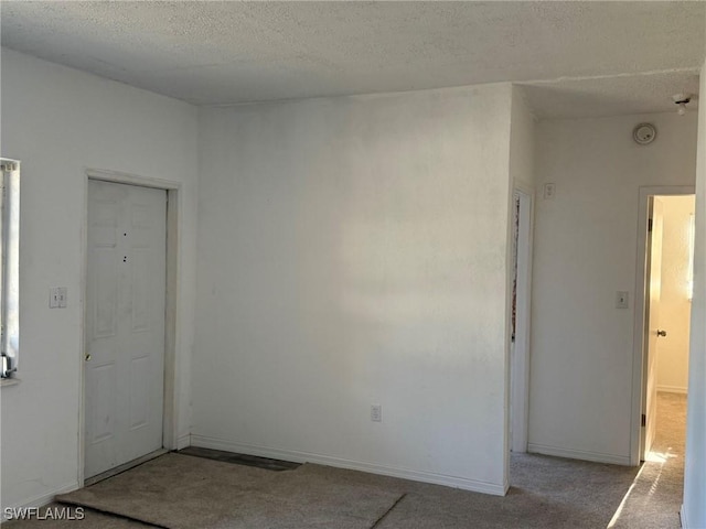 1308 Brookhill Dr, Fort Myers, FL 33916 - carpeted spare room featuring baseboards and a textured ceiling