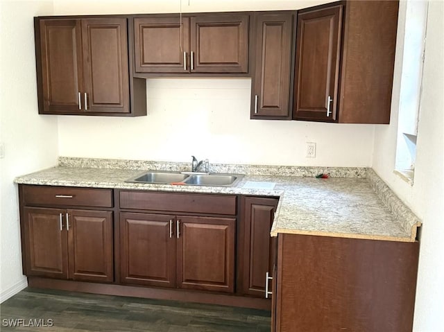 1308 Brookhill Dr, Fort Myers, FL 33916 - kitchen featuring light countertops, a sink, dark brown cabinetry, and dark wood-style floors
