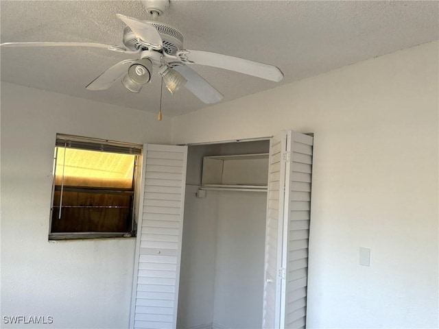 1308 Brookhill Dr, Fort Myers, FL 33916 - unfurnished bedroom with a closet, a textured ceiling, and a ceiling fan