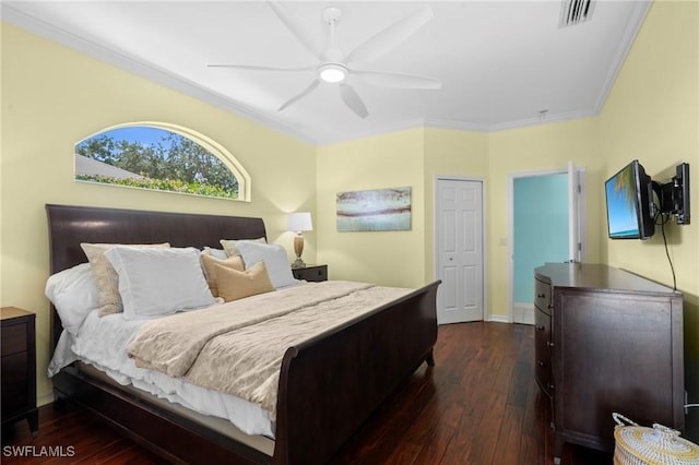 bedroom featuring a ceiling fan, dark wood-style flooring, crown molding, and visible vents