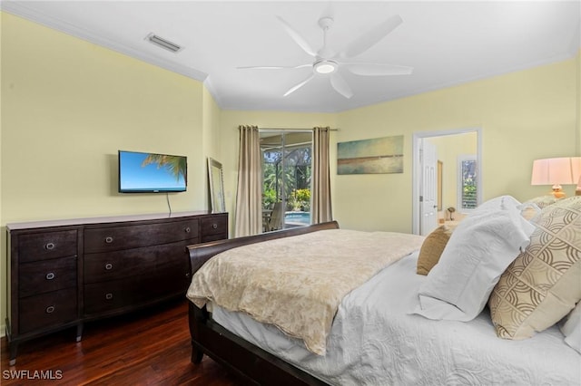 bedroom with visible vents, dark wood-type flooring, ceiling fan, and crown molding