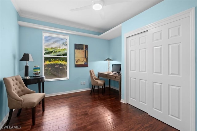 office area with baseboards, crown molding, dark wood-style floors, and ceiling fan