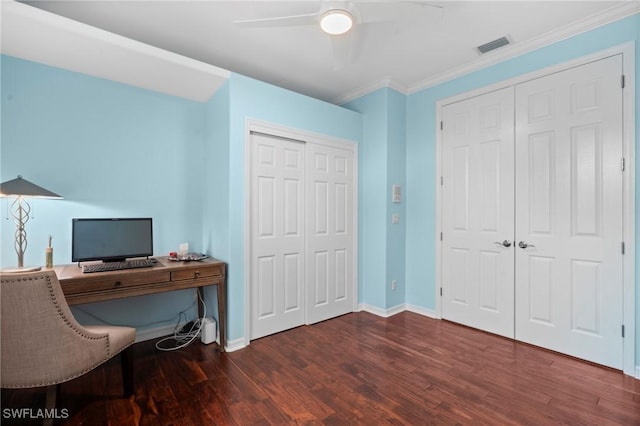 office area with wood finished floors, visible vents, a ceiling fan, ornamental molding, and baseboards