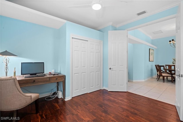 office with ceiling fan, crown molding, wood finished floors, and visible vents