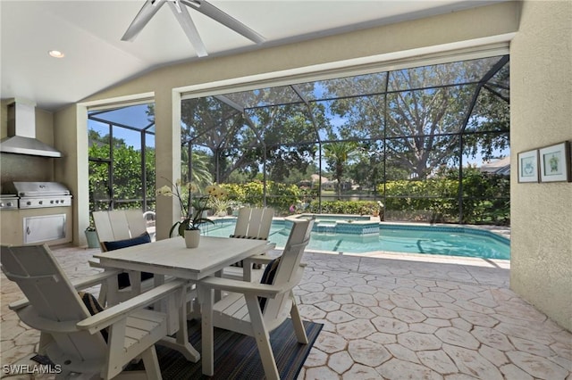 view of pool with grilling area, a patio area, a lanai, and a pool with connected hot tub