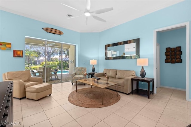 living area featuring ceiling fan, visible vents, and light tile patterned floors